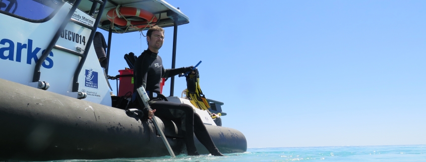 Dr Tom Holmes on a research boat